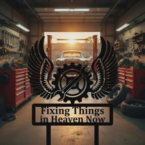 May include: Metal sign with a gear and wrench design, flanked by wings, and the text "Fixing Things in Heaven Now." The sign is set in a garage with tools, a classic car, and a sunset in the background.