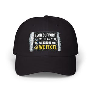 May include: Black baseball cap with the text "TECH SUPPORT: WE HEAR YOU, WE IGNORE YOU, WE FIX IT." The text is in white, blue, and yellow. The cap has a curved brim and a structured crown.