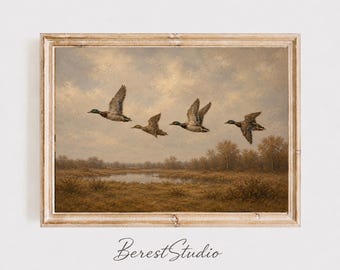 May include: A framed landscape painting featuring four ducks in flight over a marshy field with a small pond and autumn-colored trees under a cloudy sky. The text Berest Studio is printed in black cursive script at the bottom of the image.