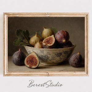 May include: A framed wall art print featuring a still life of fresh figs in a blue and white patterned ceramic bowl. Several whole dark purple and light green figs are arranged inside and around the bowl, with one fig sliced open to reveal its red interior.