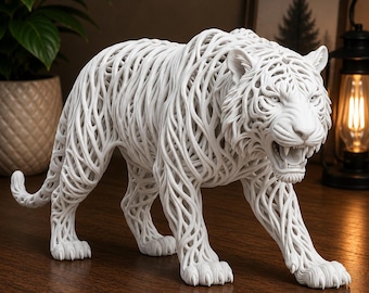 May include: A white tiger sculpture featuring an intricate, open-work lattice design that forms the shape of a prowling tiger. The figure displays a snarling expression with visible teeth and detailed fur-like patterns created by interconnected lines.