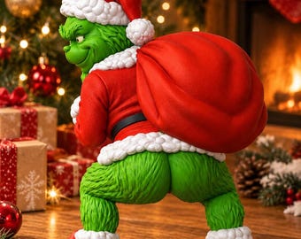 May include: A green creature figurine wearing a red Santa suit with white fur trim and a matching hat. The figure is bent over, looking back over its shoulder, and carrying a large, rounded red sack on its back. It wears red boots and has textured green fur.