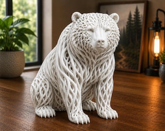 May include: A white bear figurine featuring an intricate, open-work lattice structure that mimics fur. The sculpture is depicted in a seated position, showcasing detailed facial features, including eyes, a nose, and claws on each of its four paws.