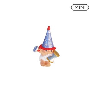 May include: A small figurine of a baby wearing a diaper and a blue cone-shaped party hat with silver star patterns and a red brim. The baby holds a blue and silver rattle in one hand and a gold and blue hourglass in the other. The text MINI is visible.