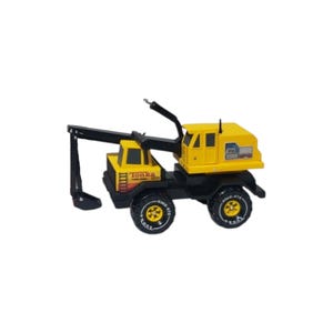 May include: A yellow and black Tonka toy construction vehicle featuring a crane arm, a cab with windows, and four large black tires with yellow rims. The side of the vehicle displays the Tonka logo and the text XMB-975 in a clear, bold font.