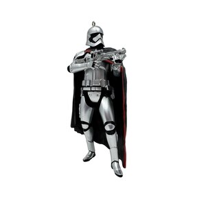 May include: A silver-colored stormtrooper figurine wearing a black cape with a red lining. The character is holding a silver blaster rifle with both hands, wearing a metallic helmet and armor plating, and features a small metal loop at the top.