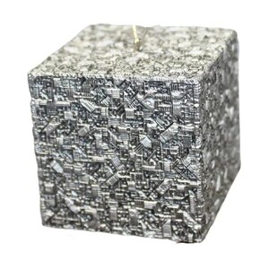 May include: A silver-colored cube ornament featuring a complex, raised geometric pattern across its surface. The texture consists of numerous small, interconnected rectangular and linear shapes, creating a dense, mechanical appearance with a metallic finish.