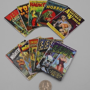 May include: A collection of vintage comic book covers with horror and suspense themes. The covers feature colorful illustrations and text, including titles like "Eerie," "Tales of Horror," and "Another World." A U.S. quarter is included for scale.