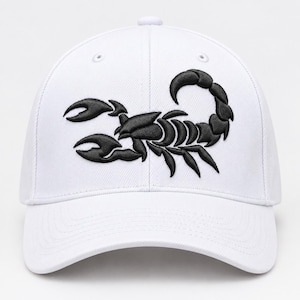 May include: A white baseball cap featuring a prominent black embroidered scorpion graphic centered on the front panel. The cap has a structured crown, a curved brim, and stitched eyelets on the top panels for ventilation and a classic design.