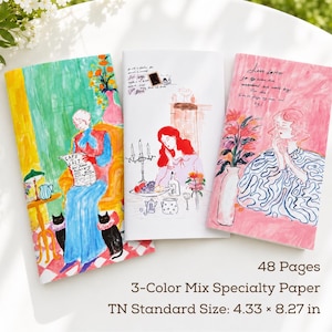 May include: Three rectangular notebooks with illustrated covers. The left shows a person reading a Cafe au Lait newspaper with two black cats. The center features a person at a table with candles. The right depicts a person with text Love letter. 48 pages, 3-color mix specialty paper, 4.33 x 8.27 inches.
