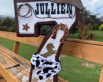 Number piñata with a cowboy theme