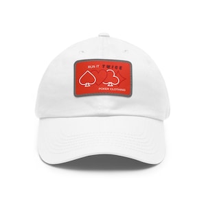 May include: White baseball cap with a red patch featuring playing card suits and the text "RUN IT TWICE POKER CLOTHING". The patch includes a spade, heart, and a club.