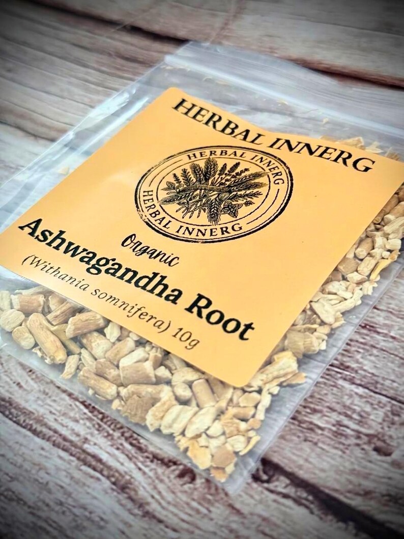 May include: A transparent bag containing dried Ashwagandha root, with a yellow label. The label reads "HERBAL INNERG" and "Ashwagandha Root", with a weight of 10g. The root pieces are light brown.