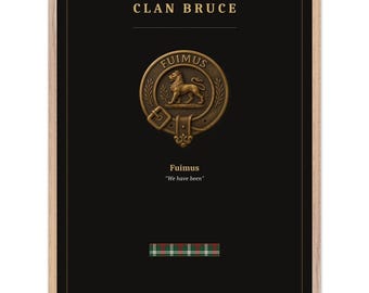 May include: A framed print featuring the text CLAN BRUCE in gold, a bronze-colored circular crest with a lion and the word FUIMUS, the text Fuimus We have been, and a small rectangular swatch of green, red, and white plaid tartan fabric.