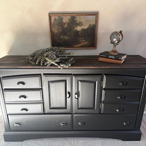 dark grey stained dresser Solid Mahogany dresser by Century Furniture refinished in a black stain . . . Available #mcm #blackfurniture #furniturerefinishing #designinspiration #design