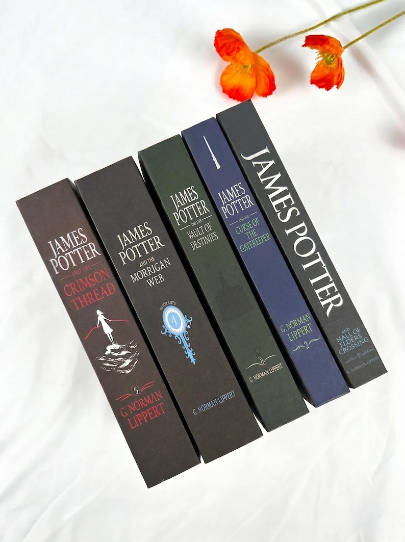 May include: Five hardcover books from the James Potter series by G. Norman Lippert, arranged in a row. The spines are colored in shades of brown, dark green, blue, and black, featuring titles, author names, and graphic illustrations.