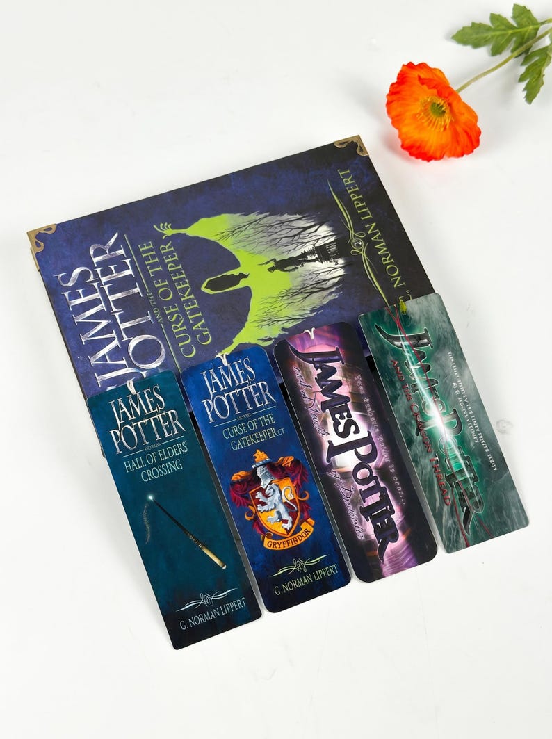 May include: A book titled James Potter and the Curse of the Gatekeeper by G. Norman Lippert, accompanied by four rectangular bookmarks. The bookmarks feature titles including Hall of Elders Crossing, Curse of the Gatekeeper, and Gryffindor crest.