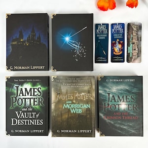 May include: A collection of five black hardcover books by G. Norman Lippert titled James Potter and the Vault of Destinies, Morrigan Web, and The Crimson Thread, accompanied by three vertical bookmarks featuring character and title illustrations.
