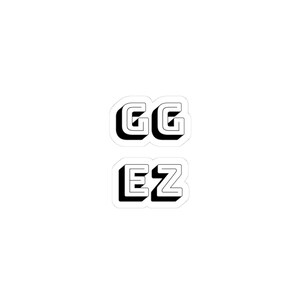 May include: Two stickers with the text "GG EZ" in a black, 3D-style font. The letters are outlined in black with a white fill, and the stickers have a white border. The stickers are on a white background.