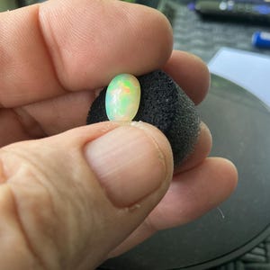 White Opal full color flashes 3.29ct. collectors item real opal from Welo mine and stableized perfect ring size and personally hand picked