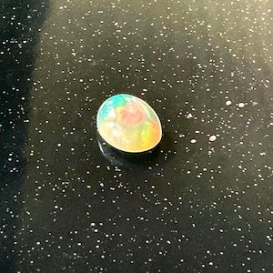 White Opal full color flashes 4.24 ct collectors item real opal from Welo mine and stableized perfect ring size and personally hand picked