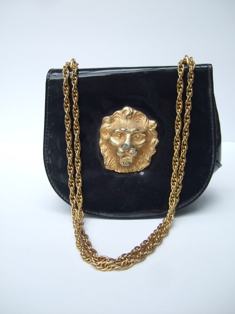 Stylish Small Dark Blue Patent Vinyl Lion Emblem Handbag c 1970s image 1