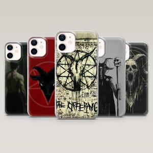 May include: A collection of phone cases with gothic and occult designs. The cases feature images of a goat skull, a pentagram, and other dark illustrations. The text "THE OFFERING" is visible on one case. The cases are in various colors, including red, black, and gray.