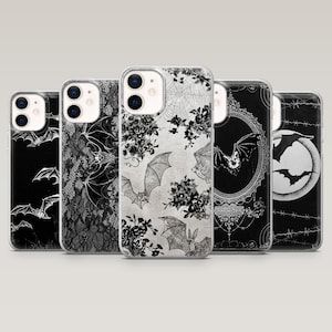 May include: Five smartphone cases arranged in a row, each featuring distinct black and white designs. Patterns include flying bats, intricate lace textures, floral motifs, spider webs, ornate oval frames, a full moon, and barbed wire illustrations.