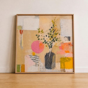 May include: Abstract art print in a wooden frame. The artwork features a vase with green and black foliage, set against a backdrop of geometric shapes in pink, orange, yellow, and white. The overall color palette is warm and inviting.