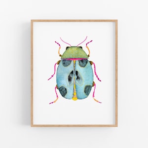 May include: A watercolor painting of a blue beetle with black spots and yellow accents. The beetle has pink legs and a green head.