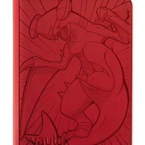 May include: A red zippered binder featuring a debossed graphic of a Garchomp creature on the front cover. The cover has a textured surface with radiating lines behind the creature and the word VaultX embossed in the bottom left corner.