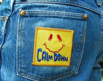 Vintage Wrangler Denim Jeans with Trippy Vintage 70s CALM DOWN Patch Size 35w x 33L