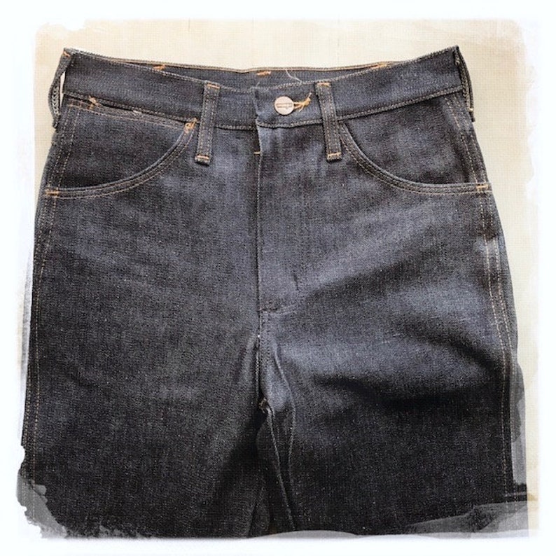 May include: A pair of dark blue denim jeans with a classic five-pocket style.