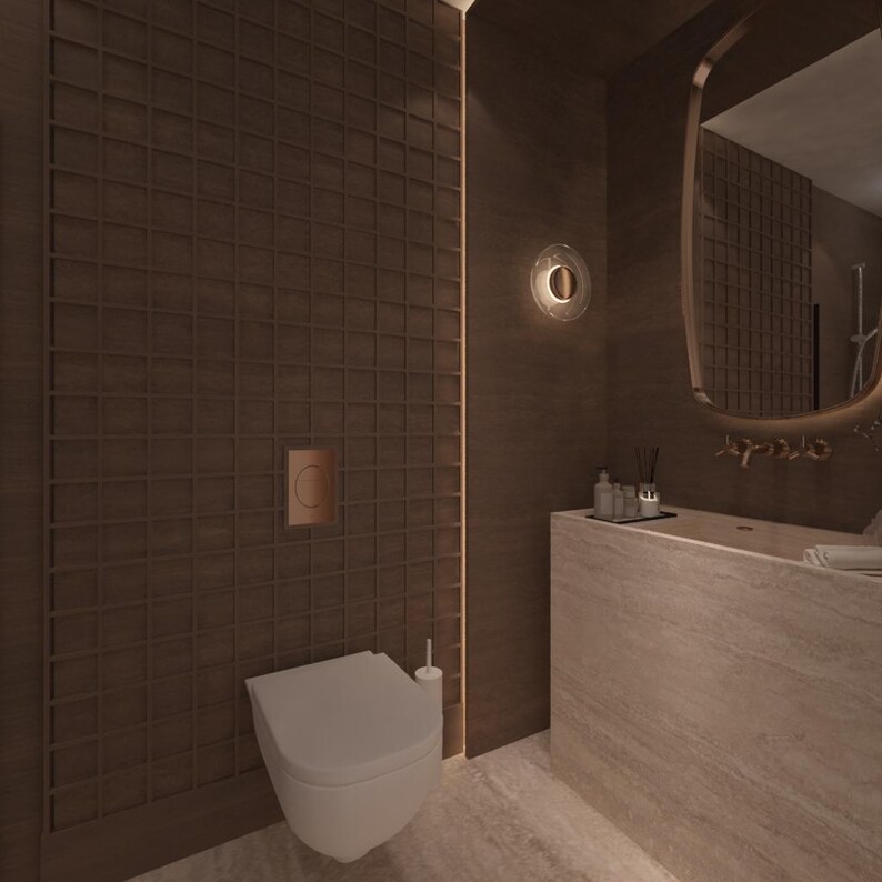May include: A modern bathroom interior featuring a white toilet, a built-in sink, and a large mirror with a gold frame. The walls are a dark brown with a grid pattern, and a circular wall sconce provides soft lighting.
