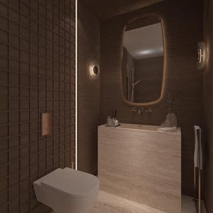 May include: A modern bathroom with a brown tiled wall and a white toilet. A rectangular stone vanity with a mirror and a towel rack are also visible. The room is illuminated by warm lighting.