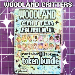 May include: A Woodland Critter Bundle token set in clear plastic packaging. The card features the text WOODLAND CRITTER BUNDLE and contains 18 tokens, each displaying a colorful hand-drawn illustration of various small animals like rabbits and squirrels.