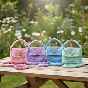 May include: Four small crochet handbags in pastel pink, lavender, light blue, and mint green. Each bag features a single top handle, a long shoulder strap, a flap closure, and a round wooden button centred on the front flap of each purse.