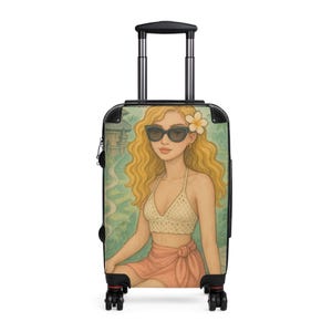 May include: A rolling suitcase featuring a colorful illustration of a woman with blonde hair, sunglasses, and a flower in her hair. The woman is wearing a white crochet top and a peach-colored wrap. The background has a tropical theme.
