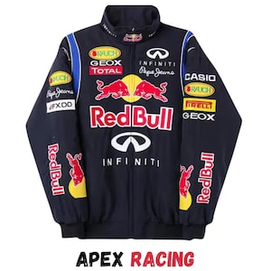 May include: A navy blue racing jacket with various sponsor logos, such as Red Bull, Infiniti, and Pepe Jeans. The jacket has a stand-up collar, a front zip, and the text "APEX RACING" at the bottom.