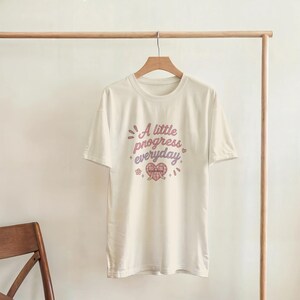 A Little Progress Everyday Graphic Tee, Motivational Quote Shirt, Inspirational Women’s T-Shirt, Positive Mindset Tee, Cute Minimalist Top image 4
