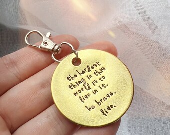 The hardest thing in this world is to live in it. Be brave. Live. Buffy key chain | tassel key chain | hand stamped | key fob