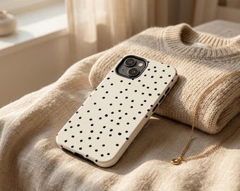 Funda minimalista para teléfono con estampado de lunares, delgada y resistente a los golpes, con lunares blancos y negros.