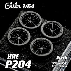 May include: Four black model car wheels with the text "Chika 1/64", "HRE P204", and "Black". The rims measure 8.8mm and the tires measure 10.5mm. The wheels have a multi-spoke design.