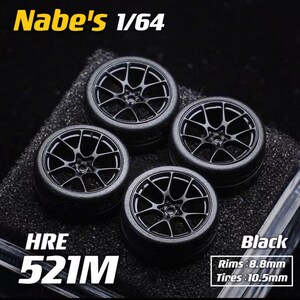 May include: Four black model car wheels with a multi-spoke design. The wheels are labeled "HRE 521M" and "Black". The rims measure 8.8mm and the tires are 10.5mm. The text "Nabe's 1/64" is also visible.