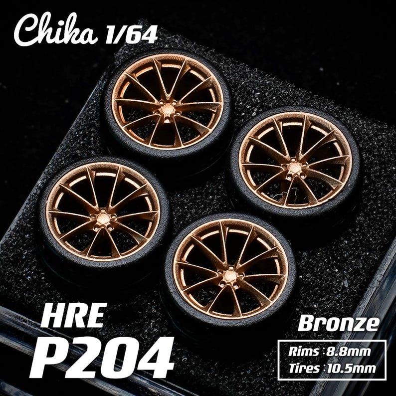 May include: Four bronze-colored model car wheels with black tires. The wheels have a multi-spoke design. The text "Chika 1/64", "HRE P204", and "Bronze" are visible. Rims are 8.8mm and tires are 10.5mm.