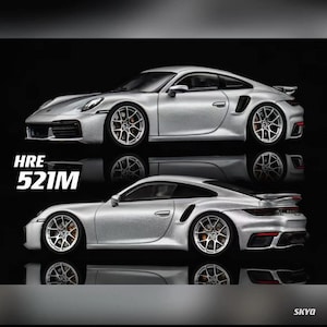 May include: Two silver sports cars are displayed, one above the other, against a black background. The cars have detailed wheels and aerodynamic designs. The text "HRE 521M" is visible on the left side of the image.