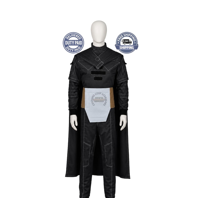 May include: A black costume set featuring a long-sleeved top with white stitching, a high collar, and a cape. The outfit includes matching black trousers and a light grey waist sash with a tan border. The ensemble is displayed on a mannequin.