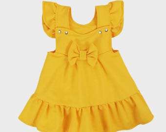 Zomerjurk voor babymeisje. Katoenen peuterjurk. Zomerkleding met ruches en strik. Meisjesoutfit voor kinderen