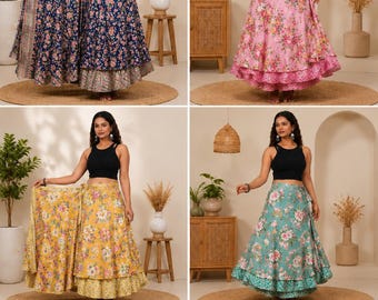 May include: A collection of six floor-length wrap skirts featuring various floral patterns in navy blue, pink, yellow, teal, cream, and maroon. Each skirt is paired with a black sleeveless crop top and displays a layered hemline design.