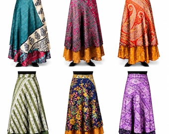 May include: Six floor-length wrap skirts featuring diverse patterns and colors, including teal, magenta, orange, green, navy blue, and purple. Each skirt displays a layered design with a distinct printed top section and a solid-colored hemline.